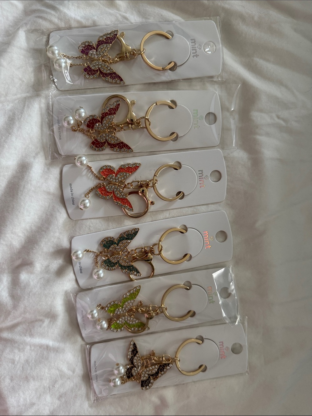 Butterfly keychains with pearls that dangle